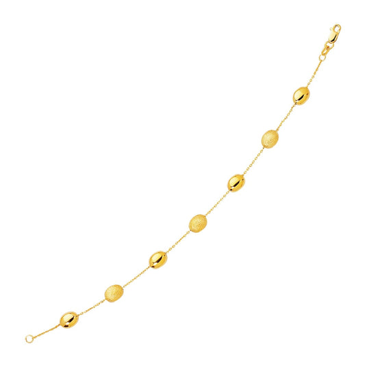 14k Yellow Gold Bracelet with Textured and Polished Pebble Stations | Richard Cannon