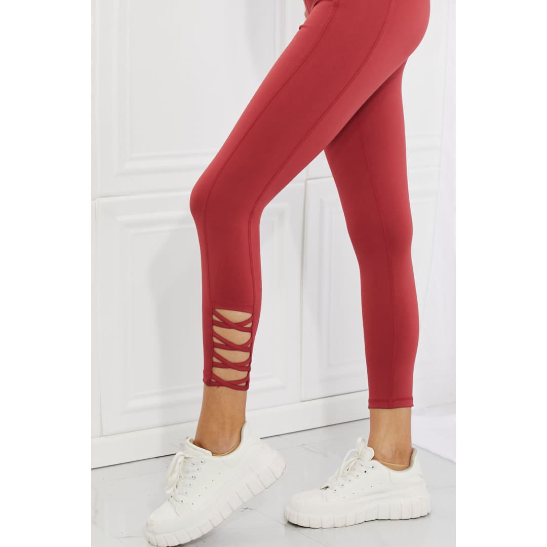 Yelete Ready For Action Full Size Ankle Cutout Active Leggings in Brick Red | The Urban